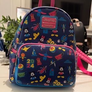 Loungefly Disney Parks Blue and Pink Backpack